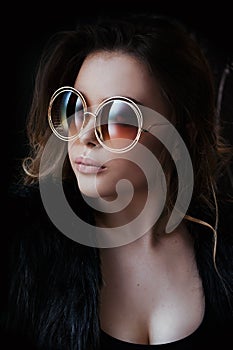 Young woman head shot, beautiful model portrait with big round sunglasses