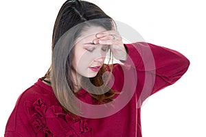 Young woman with a headache and puts her hand on her forehead