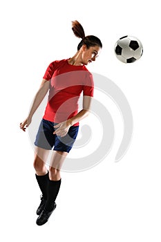 Young Woman HEading Soccer Ball