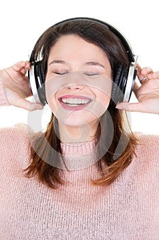 Young woman with headphones and eyes closed smiling happy