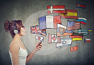 Young woman in headphones learning different languages