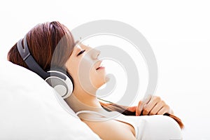 Young Woman with headphones listening music