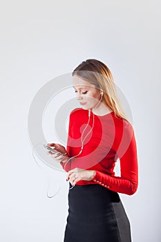 Young woman in headphones listening music relaxing at home