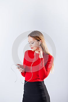 Young woman in headphones listening music relaxing at home