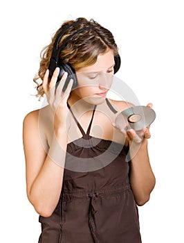 Young woman in headphones listening to music
