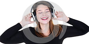 Young woman with headphones listens to the music and feels good closed eyes