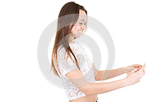 Young woman with headphones looks in camera on white background