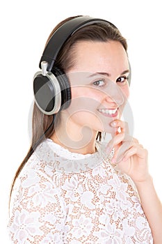 Young woman with headphones looks in camera on white background