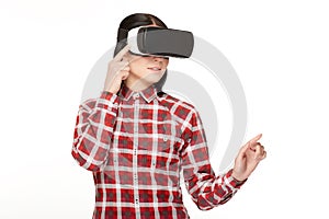 Young woman in headset of VR spending time in cyberspace.