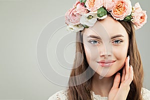 Young Woman with Healthy Clear Skin, Brown Hair, Natural Makeup and Flowers Wreath on her Head, Fashion Beauty Portrait