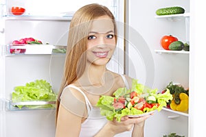 Young woman with healthy salad