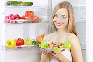 Young woman with healthy salad