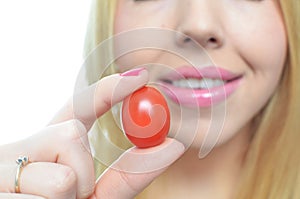 Young woman with healthy tomato