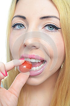 Young woman with healthy tomato