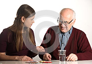 Young woman helps senior man