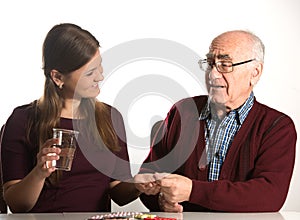 Young woman helps senior man