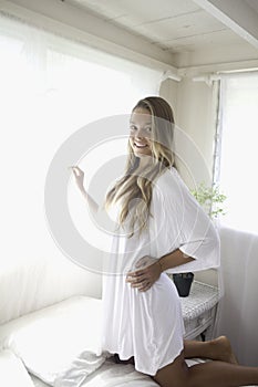 Young woman in her bedroom