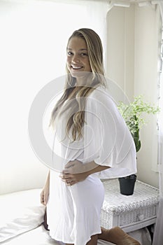 Young woman in her bedroom