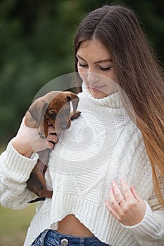 Young woman with her dachshund