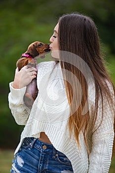 Young woman with her dachshund