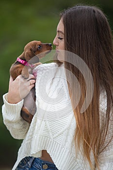 Young woman with her dachshund