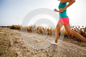 Young woman on her evening jog along the seacoast