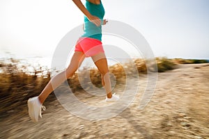 Young woman on her evening jog along the seacoast