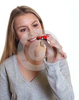 Young woman with her first car