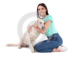 Young woman and her Golden Retriever dog