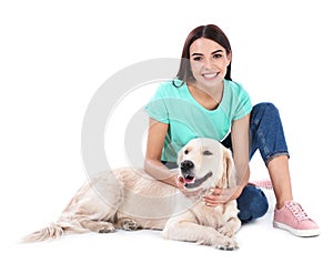 Young woman and her Golden Retriever dog