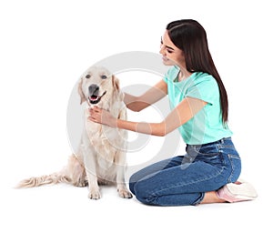 Young woman and her Golden Retriever dog