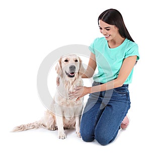 Young woman and her Golden Retriever dog on white