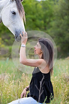 Young woman with her horse