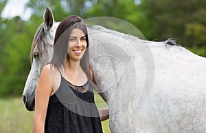 Young woman with her horse