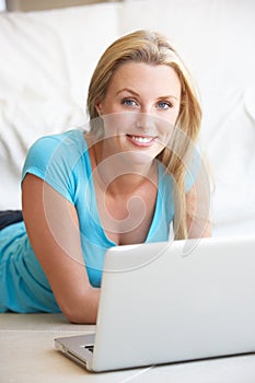 Young woman on her laptop computer