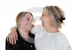 Young woman with her mother women looking at each other loving accomplice isolated on white background photo