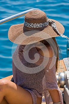 Young woman on her private yacht