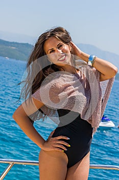 Young woman on her private yacht