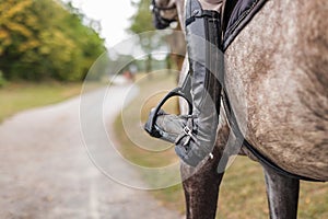 Young woman and her red horse during a calm trail ride