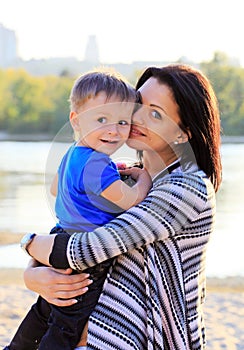 Young woman and at her son outdoors