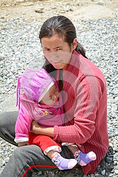 Young woman and her son at Tibetan village in Ladakh, India