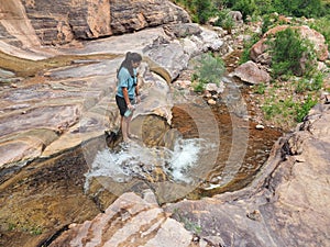 Young woman in Hermit Creek, Grand Canyon National Park.