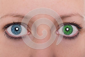 Young woman with heterochromia iridum, two different eye color