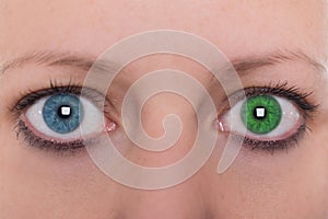 Young woman with heterochromia iridum, two different eye color photo
