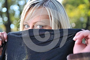 Young woman hiding her face