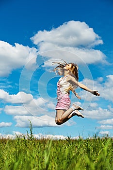 Young woman high jumps