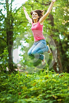 Young woman high jumps