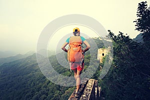 Woman hiker hiking on great wall