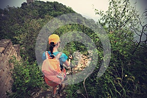 Woman hiker hiking on great wall