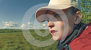 Young woman hiker outdoor enjoying the view of nature